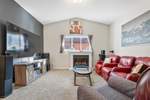 178 Buckskin Way, Cochrane, AB - Indoor Photo Showing Living Room With Fireplace