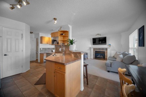 154 Bridlewood Court Sw, Calgary, AB - Indoor With Fireplace