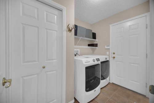 154 Bridlewood Court Sw, Calgary, AB - Indoor Photo Showing Laundry Room