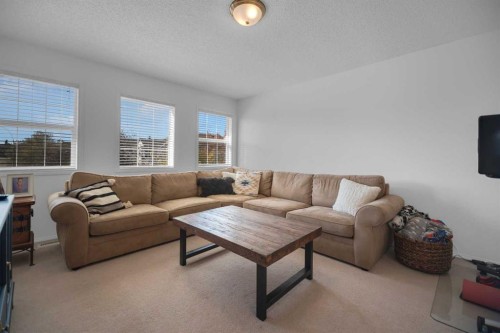 154 Bridlewood Court Sw, Calgary, AB - Indoor Photo Showing Living Room