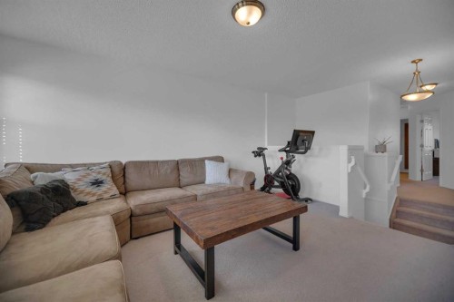 154 Bridlewood Court Sw, Calgary, AB - Indoor Photo Showing Living Room