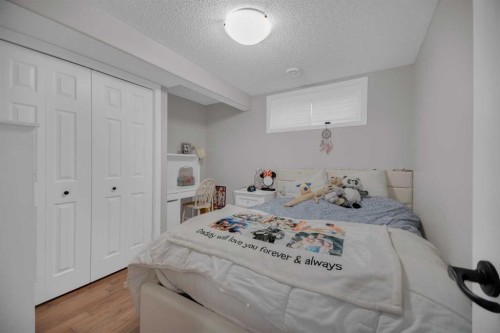 154 Bridlewood Court Sw, Calgary, AB - Indoor Photo Showing Bedroom