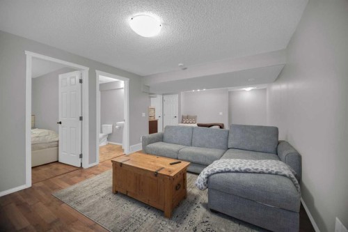 154 Bridlewood Court Sw, Calgary, AB - Indoor Photo Showing Living Room