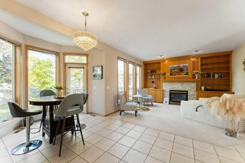 10 Grande Point Estates, Strathmore, AB - Indoor Photo Showing Dining Room With Fireplace