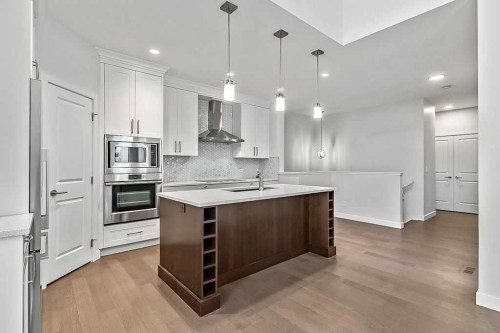 54 Drake Landing Square, Okotoks, AB - Indoor Photo Showing Kitchen With Upgraded Kitchen