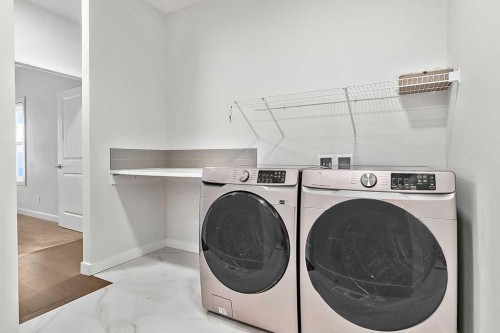 54 Drake Landing Square, Okotoks, AB - Indoor Photo Showing Laundry Room