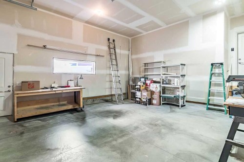 54 Drake Landing Square, Okotoks, AB - Indoor Photo Showing Garage