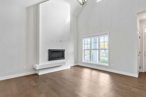 54 Drake Landing Square, Okotoks, AB - Indoor Photo Showing Other Room With Fireplace