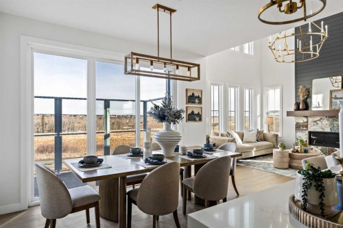 86 Cimarron Estates Drive, Okotoks, AB - Indoor Photo Showing Dining Room With Fireplace