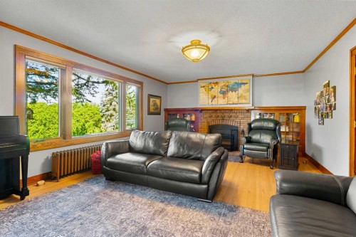 10 & 20-30061 Range Road 23, Rural Mountain View County, AB - Indoor Photo Showing Living Room With Fireplace