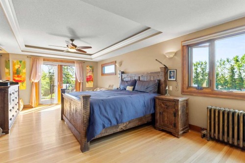10 & 20-30061 Range Road 23, Rural Mountain View County, AB - Indoor Photo Showing Bedroom