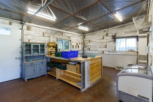 10 & 20-30061 Range Road 23, Rural Mountain View County, AB - Indoor Photo Showing Garage