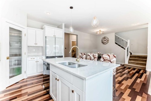 210 Copperleaf Bay Se, Calgary, AB - Indoor Photo Showing Kitchen With Double Sink With Upgraded Kitchen
