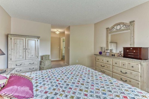 7 Scotia Landing Nw, Calgary, AB - Indoor Photo Showing Bedroom