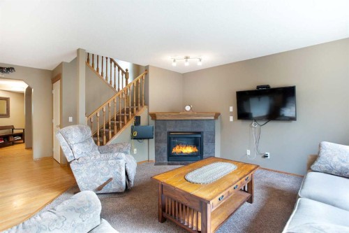 196 Brightondale Close Se, Calgary, AB - Indoor Photo Showing Living Room With Fireplace