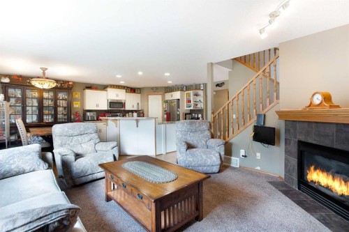 196 Brightondale Close Se, Calgary, AB - Indoor Photo Showing Living Room With Fireplace