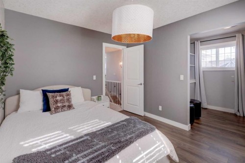213 Kingsmere Cove Se, Airdrie, AB - Indoor Photo Showing Bedroom