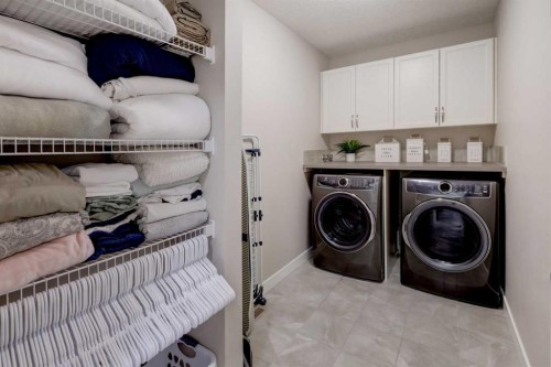 213 Kingsmere Cove Se, Airdrie, AB - Indoor Photo Showing Laundry Room
