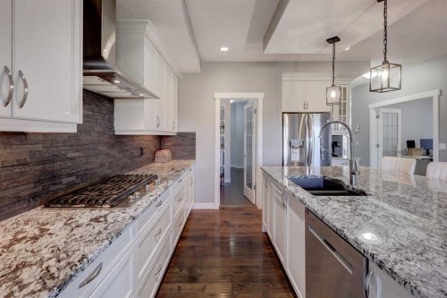 213 Kingsmere Cove Se, Airdrie, AB - Indoor Photo Showing Kitchen With Double Sink With Upgraded Kitchen