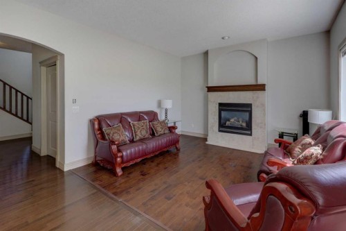 112 Cougarstone Manor Sw, Calgary, AB - Indoor Photo Showing Living Room With Fireplace