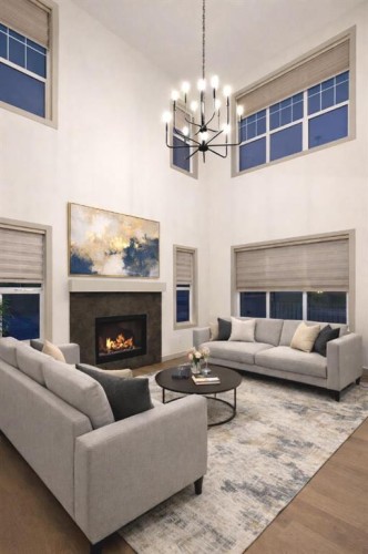 37 North Bridges Landing, Langdon, AB - Indoor Photo Showing Living Room With Fireplace