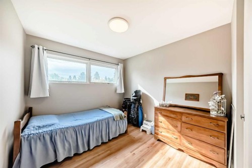 126 Springwood Drive Sw, Calgary, AB - Indoor Photo Showing Bedroom