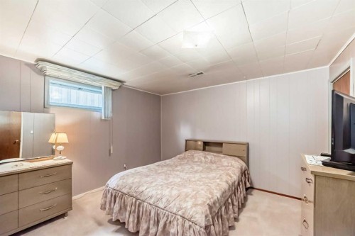 126 Springwood Drive Sw, Calgary, AB - Indoor Photo Showing Bedroom