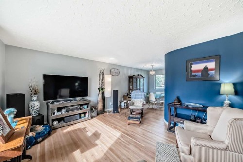 126 Springwood Drive Sw, Calgary, AB - Indoor Photo Showing Living Room