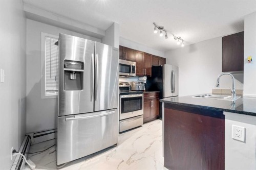 102-15 Saddlestone Way Ne, Calgary, AB - Indoor Photo Showing Kitchen