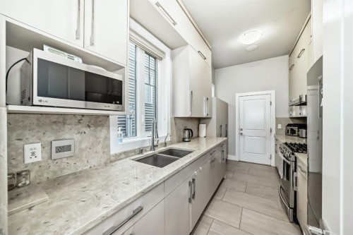 3149 Winspear Crescent Sw, Edmonton, AB - Indoor Photo Showing Kitchen With Double Sink