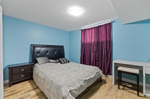 935 Windhaven Close Sw, Airdrie, AB - Indoor Photo Showing Bedroom