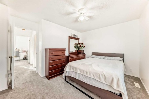 79 Hidden Crescent Nw, Calgary, AB - Indoor Photo Showing Bedroom