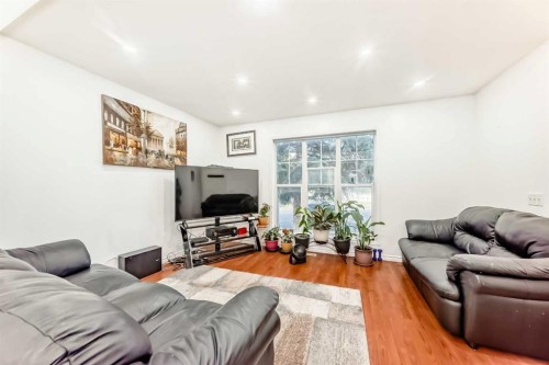 79 Hidden Crescent Nw, Calgary, AB - Indoor Photo Showing Living Room