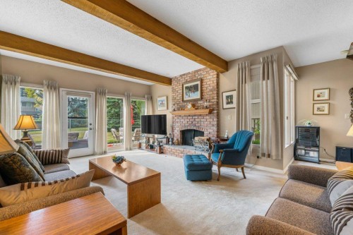 258-20 Midpark Crescent Se, Calgary, AB - Indoor Photo Showing Living Room With Fireplace