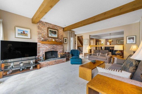 258-20 Midpark Crescent Se, Calgary, AB - Indoor Photo Showing Living Room With Fireplace