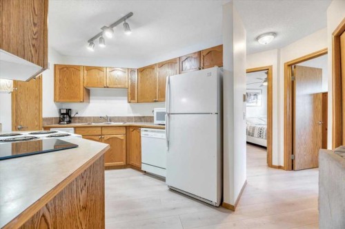 308-11 Somervale View Sw, Calgary, AB - Indoor Photo Showing Kitchen With Double Sink
