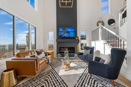 159 Brander Avenue, Langdon, AB - Indoor Photo Showing Living Room With Fireplace