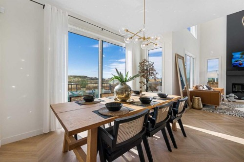 159 Brander Avenue, Langdon, AB - Indoor Photo Showing Dining Room With Fireplace