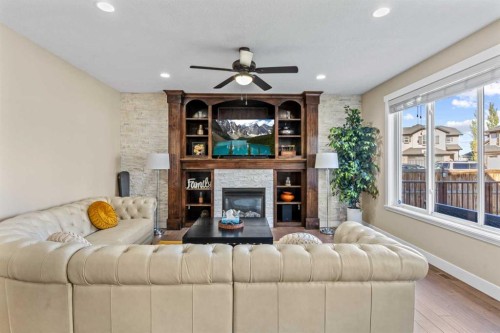1269 Sherwood Boulevard Nw, Calgary, AB - Indoor Photo Showing Living Room With Fireplace