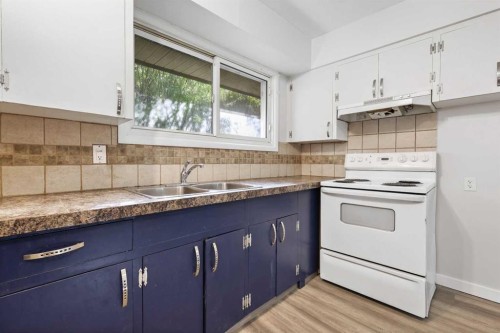 1816 42 Street Se, Calgary, AB - Indoor Photo Showing Kitchen With Double Sink