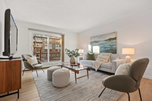 319-723 57 Avenue Sw, Calgary, AB - Indoor Photo Showing Living Room