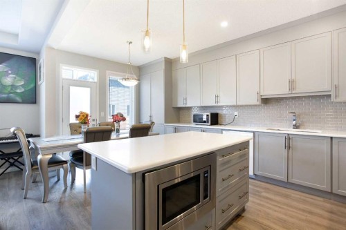 158 Osborne Common Sw, Airdrie, AB - Indoor Photo Showing Kitchen With Upgraded Kitchen