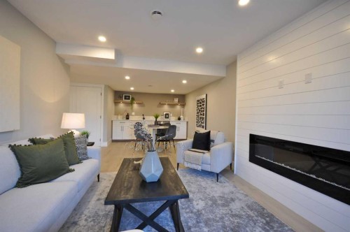 1 Cherovan Drive Sw, Calgary, AB - Indoor Photo Showing Living Room With Fireplace
