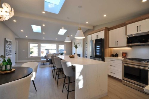 1 Cherovan Drive Sw, Calgary, AB - Indoor Photo Showing Kitchen With Upgraded Kitchen