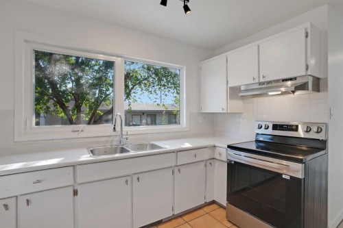 6014 37 Street Sw, Calgary, AB - Indoor Photo Showing Kitchen With Double Sink