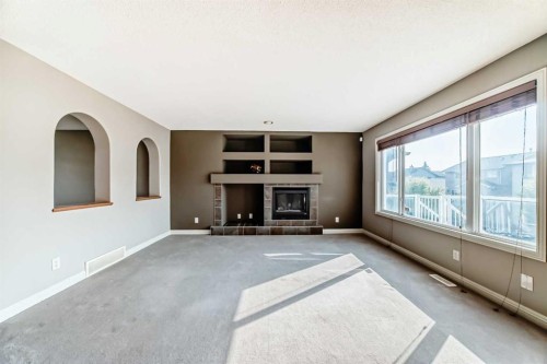 130 Panamount View Nw, Calgary, AB - Indoor With Fireplace