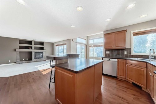 130 Panamount View Nw, Calgary, AB - Indoor Photo Showing Kitchen With Fireplace