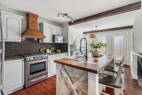 52 Canoe Road Sw, Airdrie, AB - Indoor Photo Showing Kitchen With Upgraded Kitchen