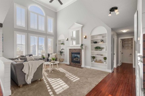 52 Canoe Road Sw, Airdrie, AB - Indoor Photo Showing Living Room With Fireplace