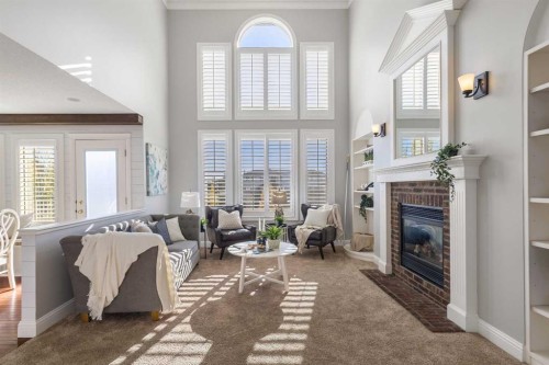 52 Canoe Road Sw, Airdrie, AB - Indoor With Fireplace